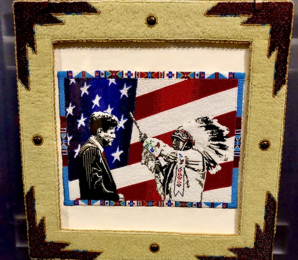 Beaded picture of a native American Chief blessing JFK at the Museum of the Rockies