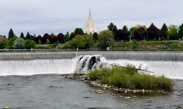 Snake River, waterfalls, trees and white church in distance seen during Our Day in Idaho Falls ID