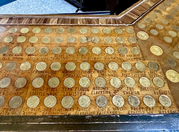 A bar top with silver dollars embedded seen on our way from Spokane WA to Coram Montana