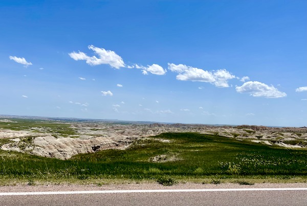 Vast expanse of rock formations and grass at Badlands National Park SD