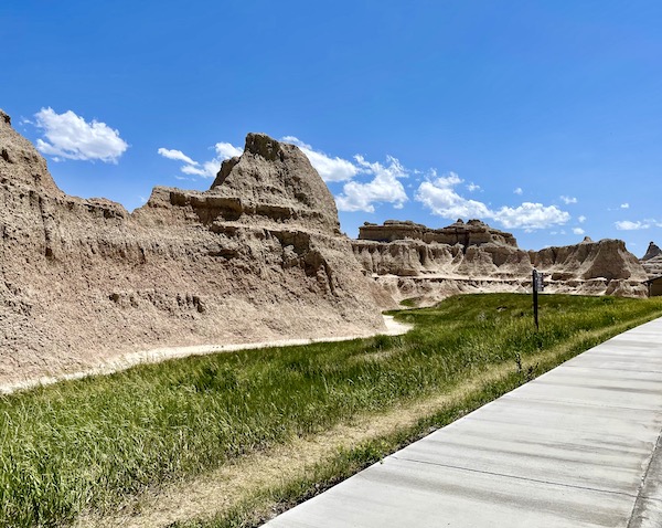 Rocks look like sand castles on grass at Badlands National Park SD