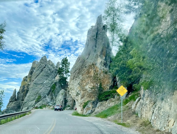 Pointed rock formations and a narrow tunnel at Custer State Park Custer SD