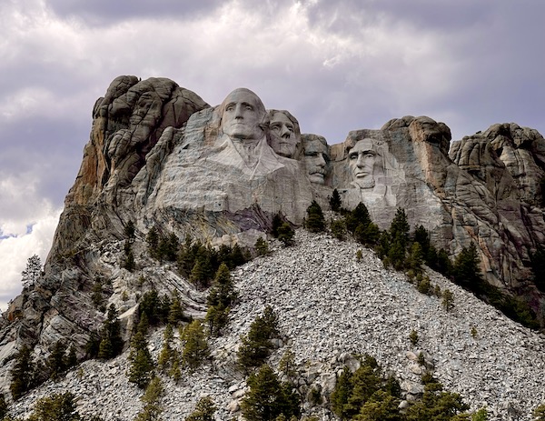Ominous clouds cast shadows on the Mount Rushmore National Memorial