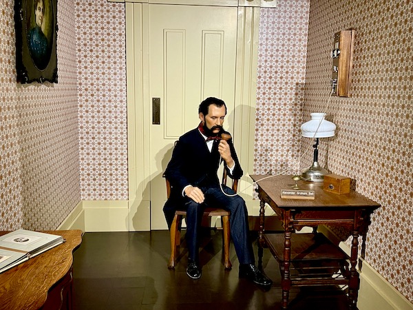 National Presidential Wax Museum Keystone SD figure of Alexander Graham Bell with the telephone.