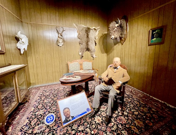 National Presidential Wax Museum Keystone SD seated figure of President Teddy Roosevelt.