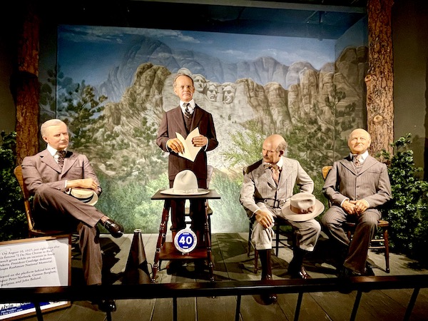 National Presidential Wax Museum Keystone SD figures of President Calvin Coolidge, Senator Peter Norbeck, Gutzon Borglum the sculptor, and John Boland.