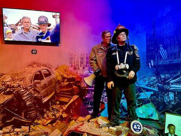 National Presidential Wax Museum Keystone SD figures of a first responder and President George W. Bush at the rubble from the Twin Towers.