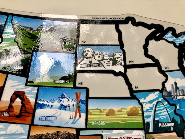 Map of USA with all but 5 states covered with state stickers.