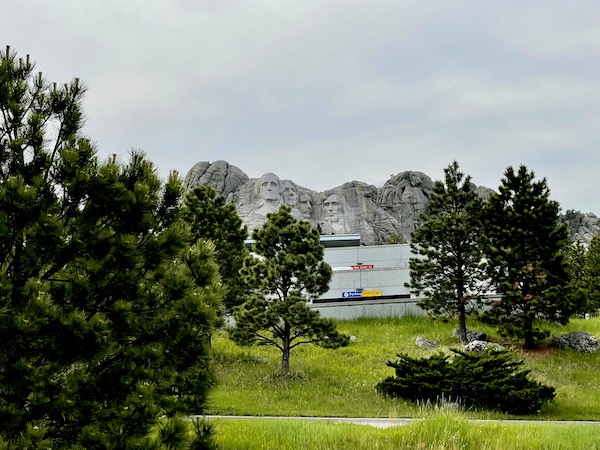 Rolling green lawn, trees and Mount Rushmore seen while staying in Keystone SD