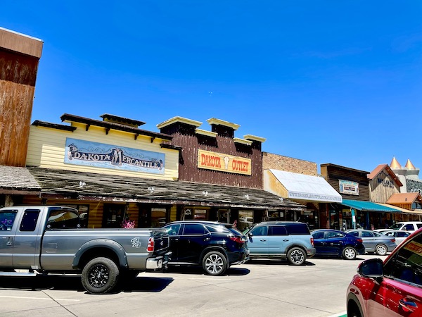 A row of stores opposite Wall Drugs Wall South Dakota have the same old west architecture.