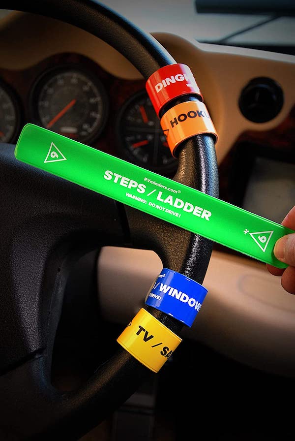 Black RV steering wheel with colorful reminders attached, part of my 2022 Holiday Gift Guide