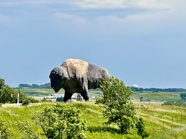 Enormous statue of a buffalo with rolling hills in the background in Jamestown ND
