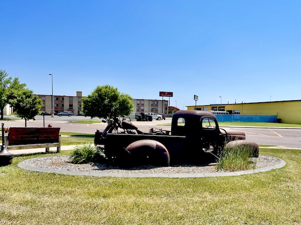 Rusty old pickup truck on display in front of a restaurant in Fargo North Dakota