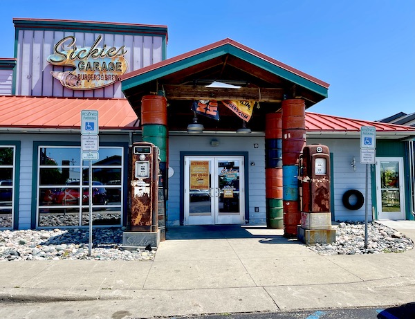Blue building with red roof looks like a garage but is a restaurant in Fargo North Dakota