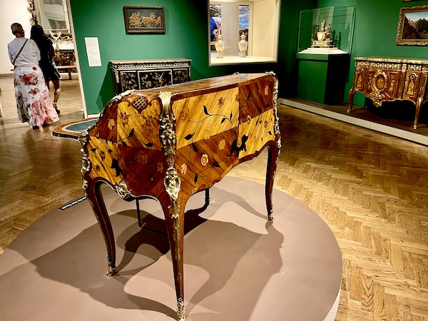 Antique writing desk with light and dark wood inlay at the Minneapolis Institute of Art