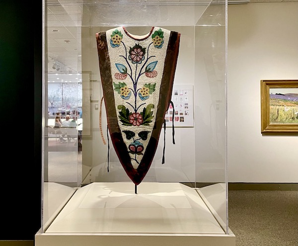 Colorful beaded cape front view at the Minneapolis Institute of Art