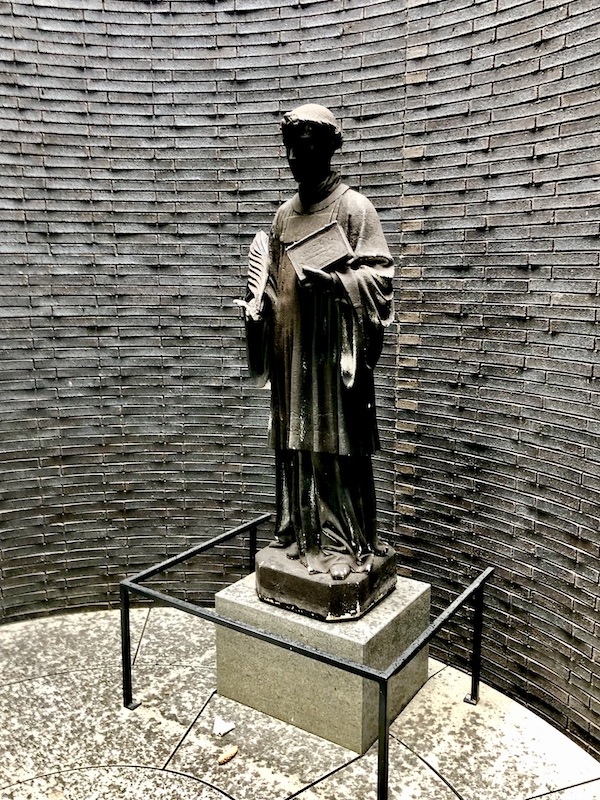 Inside a cylindrical sculpture that houses a concrete sculpture of a saint at the Minneapolis Sculpture Garden Minnesota