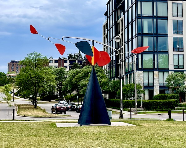 Colorful metal flags spin on top of a black pyramid at the Minneapolis Sculpture Garden Minnesota