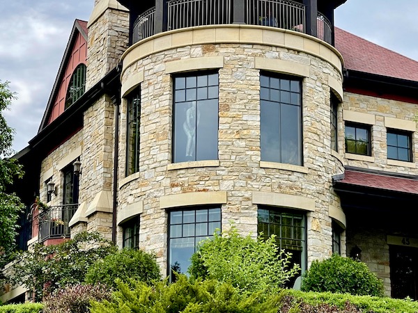 Close up of house reveals painting in upper left window in Minneapolis