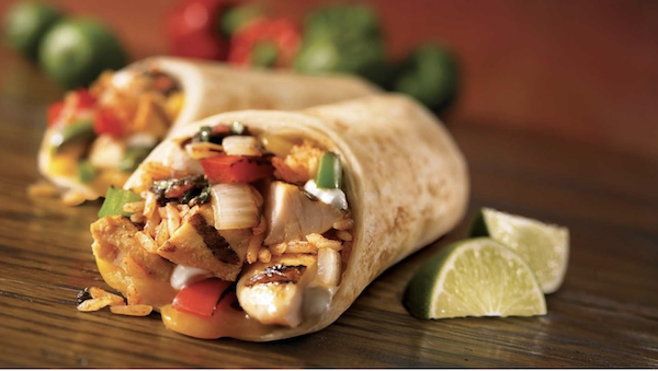 Burrito filled with chicken and veggies, cut in half, served with lime wedges is one of 4 Easy Ways to Expand Your Palate