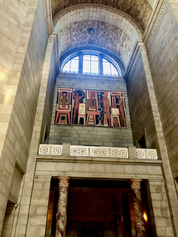 Angular figures in this mural by Kenneth Evett represents Labor of the Head with sciences such as biology and engineering in the Nebraska State Capitol in Lincoln