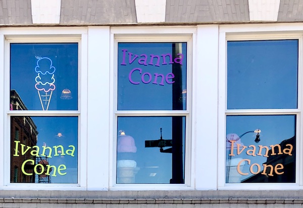 Windows in an old building painted to welcome you to Ivanna Cone