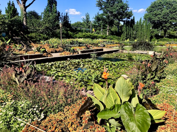 Colorful plants and flowers surrounding a water feature at Sunken Gardens Lincoln Nebraska