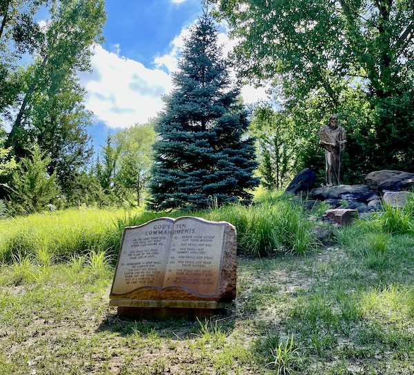 Garden setting for a 10 commandments tablet and statue of Moses at Trinity Heights Sioux City IA
