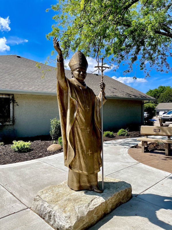 Bronze religious sculpture welcomes you to Trinity Heights Sioux City IA