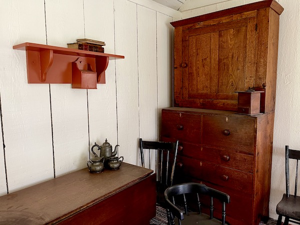 Dark wood cabinet, table and chairs in H. Hoover's birthplace
