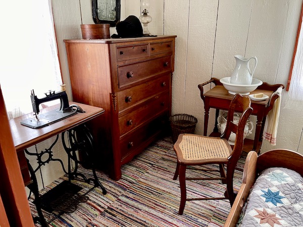 Wood dresser and antique sewing machine in the Herbert Hoover birthplace