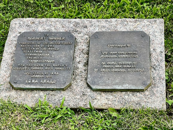 Granite marker with bronze plaques honoring H. Hoover with the Iowa Award