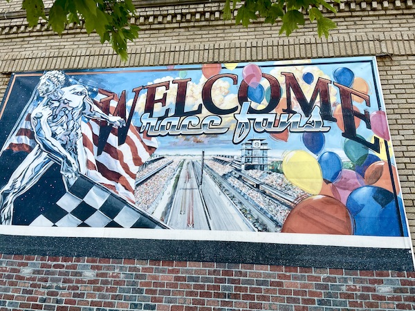 Wall mural with racing flags on brick wall at Indianapolis Speedway Indiana