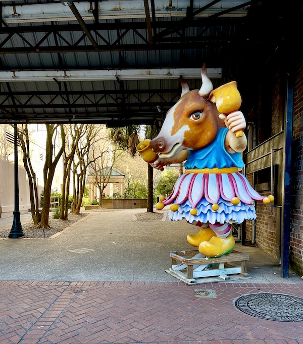Colorful statue of a cow in a dress for Mardi Gras 2023 New Orleans