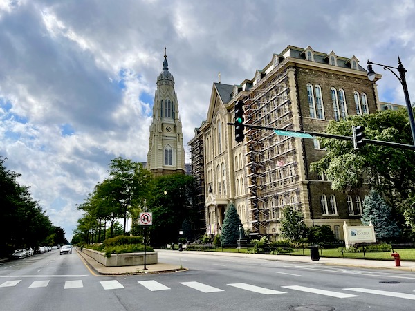 Tan brick building and tower with spire seen on Our Driving Tour of Chicago IL