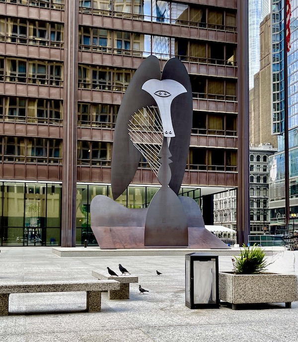 Metal sculpture looks like a Picasso animal in front of a building seen on Our Driving Tour of Chicago IL