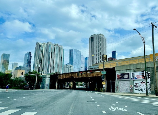 View of skyscrapers from the street in front of a rusty bridge seen on Our Driving Tour of Chicago IL