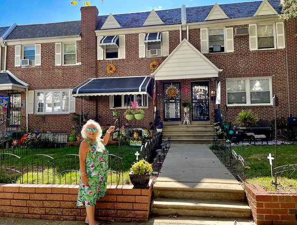 Red brick row house with awning and me in front. Another in the collection of All Our Houses in Northeastern America