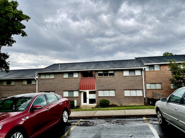 Brown brick apartment complex that was our first home.