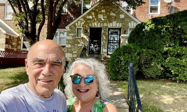 Stone and red brick row house with Steve and I in front.
