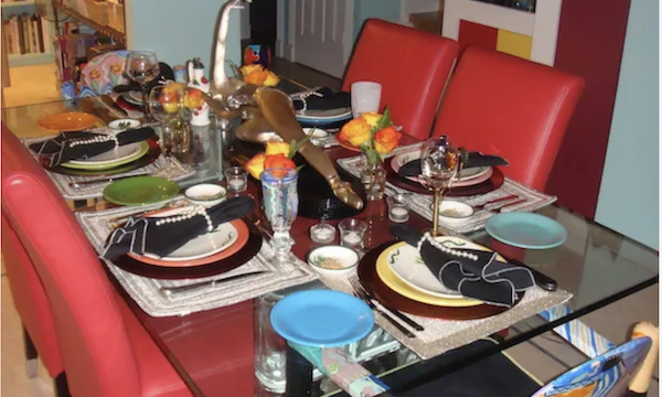 Dining table set for a restaurant experience in the home, shows how to be Creating a Restaurant Experience at Home