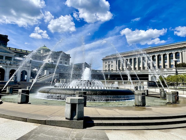 Circular fountain with water coming from all jets in front of The beautiful Pennsylvania State Capitol in Harrisburg