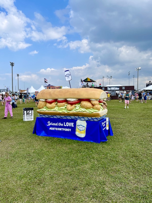 Giant po' boy sculpture on lawn at Hogs For The Cause NOLA