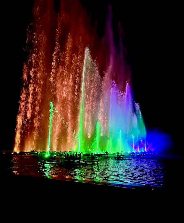 Water fountains shoot up from the pool in a myriad of colors at The nighttime spectacle Light: Installations by Bruce Munro opens June 30 at Longwood Gardens. Created by English/Australian artist Bruce Munro, Light features eight installations, spanning indoors and outdoors. Highlights include the luminous Field of Light featuring 18,000 illuminated bulbs stretching across the landscape, a flamboyance of 1,000 flamingoes wading near the Chimes Tower, and C-scales, a shimmering canvas of 8,960 CDs in the Exhibition Hall that reflect colorful projections inspired by Longwood’s water gardens.