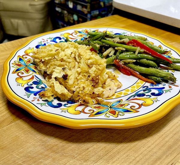 Colorful plate topped with Tasting Alaska Potato Chip Crusted Salmon and a vegetable medley