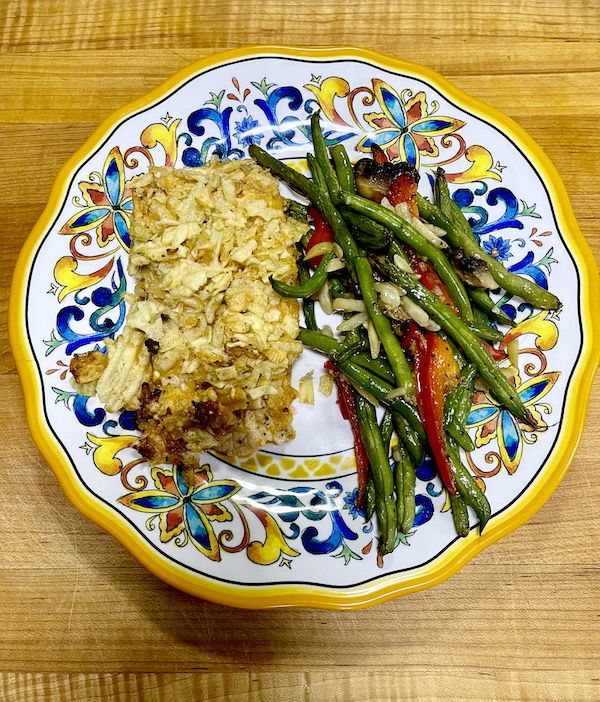 Colorful plate topped with Tasting Alaska Potato Chip Crusted Salmon and a vegetable medley