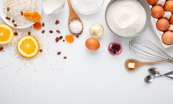 Recipe ingredients spread out on a white counter to show new Ways to Enjoy Cooking Even More