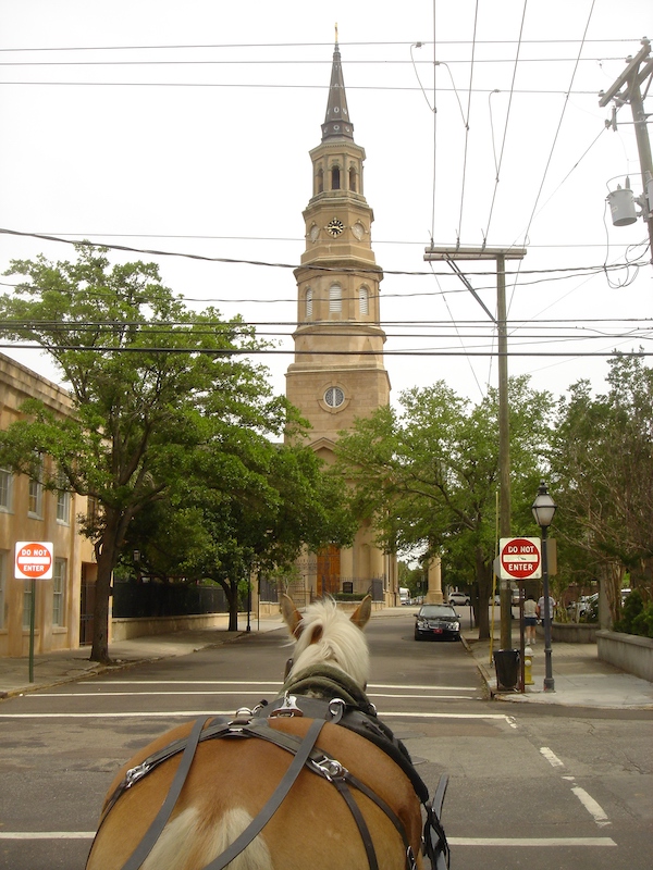Tall church at end of street viewed from horse drawn carriage on our 2006 RV journey.