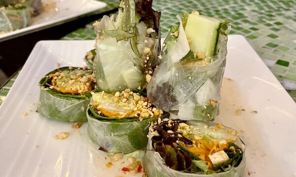 Fresh Spring Rolls filled with vegetables on a large platter, in another place for Good Eats in the Big Easy