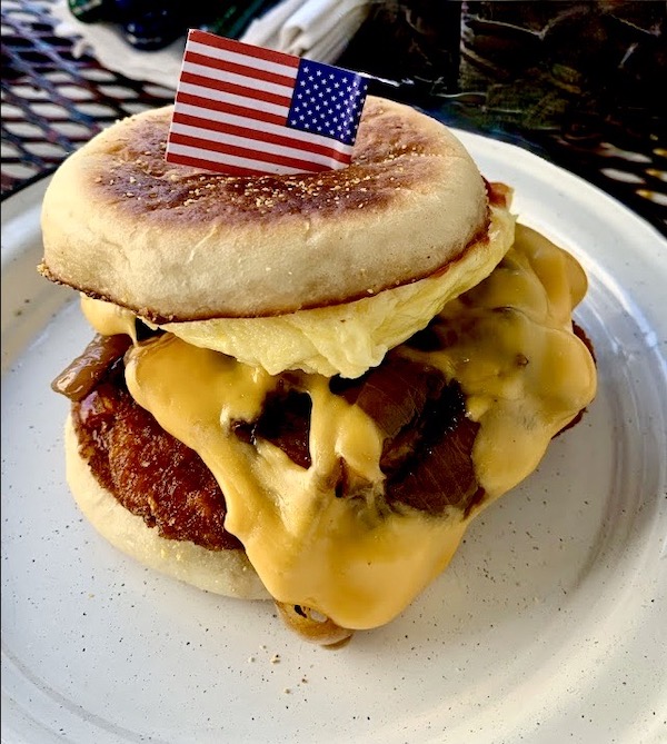 English muffin sandwich with sausage, egg and cheese at Molly's Rise and Shine in the big easy
